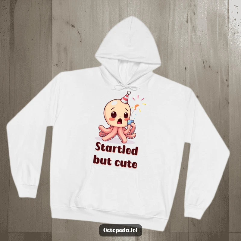 Funny Octopus Hoodie: A baby octopus character humorously startled by a popping party popper, offering cozy, comical vibes.