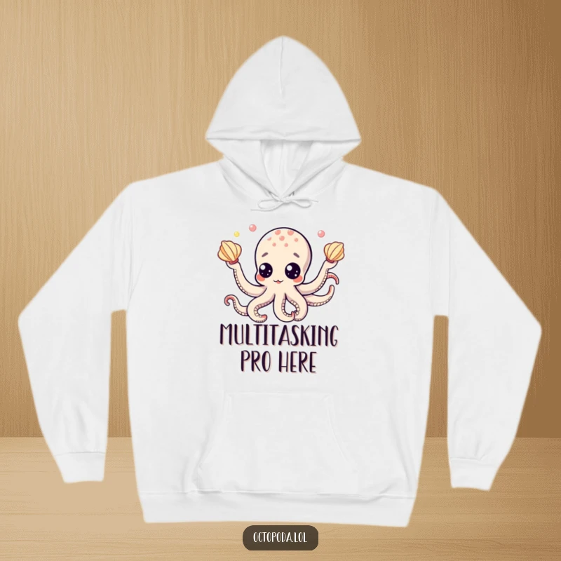 Funny hoodie featuring a comical octopus with large googly eyes, juggling shiny seashells, perfect for a fun, cozy look.