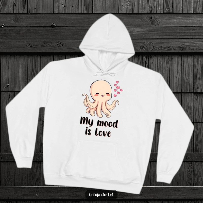 Funny hoodie featuring a baby octopus blowing heart-shaped ink clouds, representing playful affection and cozy warmth.